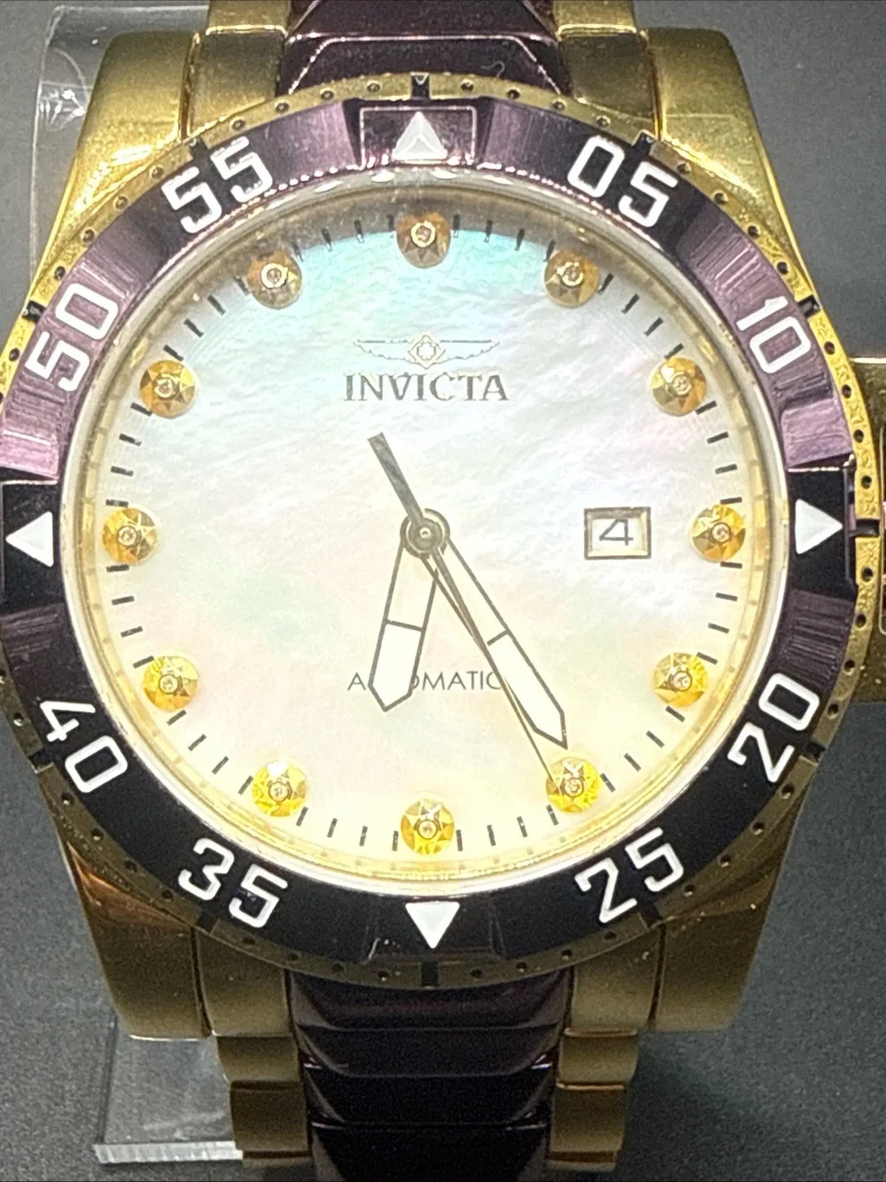 Invicta Excursion model 33349 MOP Dial Purple Gold Tone